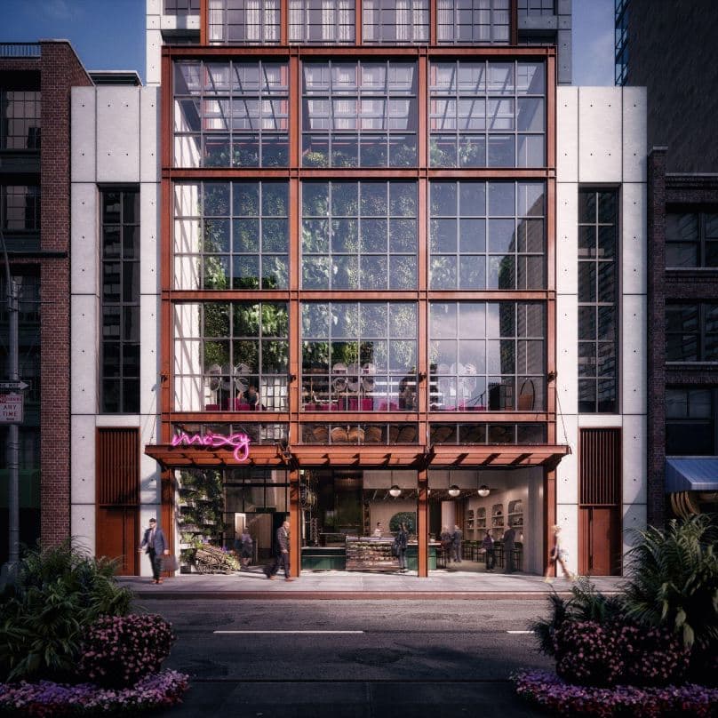 陽光充足的 Moxy Chelsea 客房，配有雙層床配置，落地窗框出帝國大廈的景色。