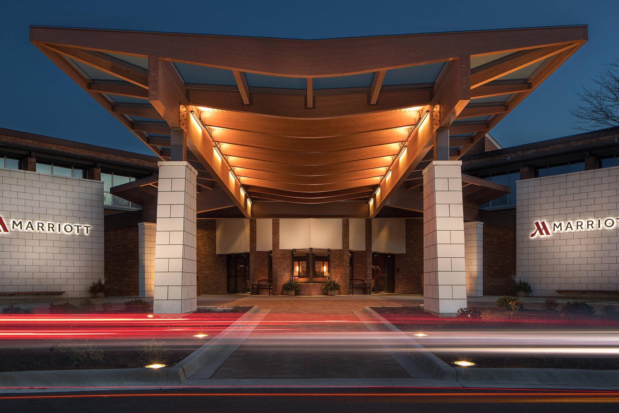 The Lincolnshire Marriott Resort's Lakeside Pavilion illuminated at twilight with a central fountain and the theater marquee in the background.