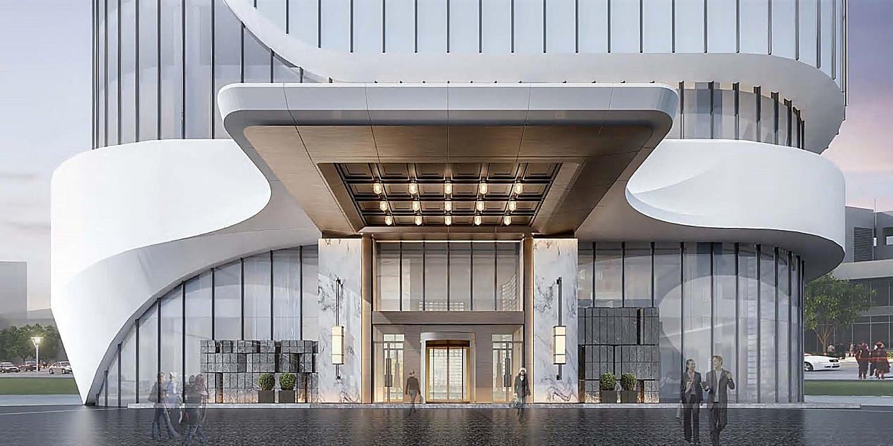 A symmetrical view of the 50-meter indoor pool at HUALUXE Qingdao Licang, featuring calm water and modern lighting.