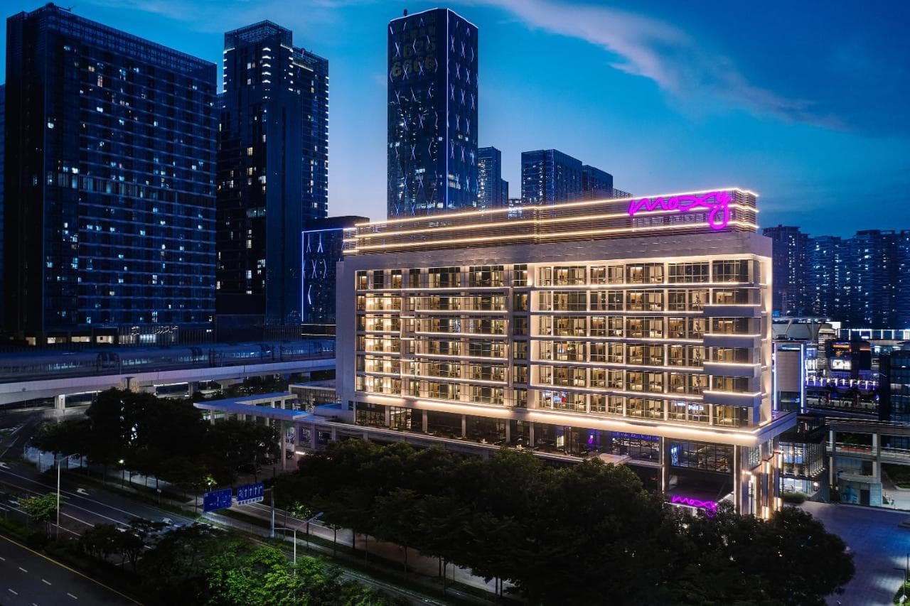 Modern lobby and bar at Moxy Shenzhen North Station, a trendy hotel near the high-speed rail.