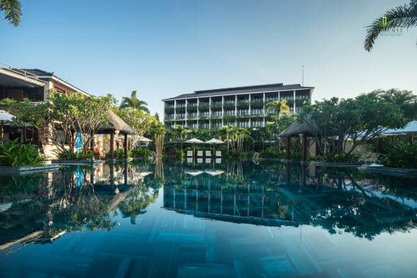 Silk Sense Hoi An River Resort salt-ozone infinity pool overlooking the Co Co River at sunset.
