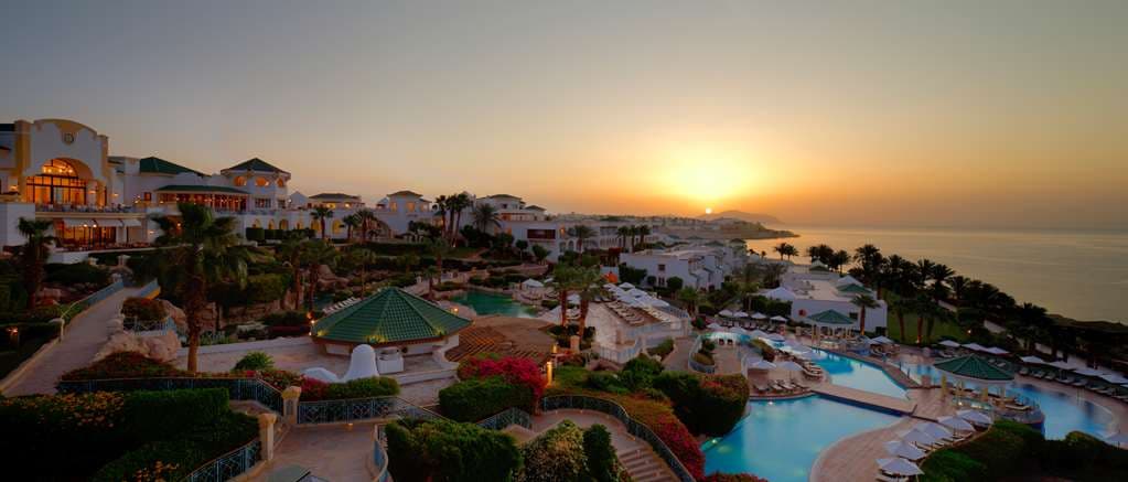 Aerial view of Park Regency Sharm El Sheikh cascading pools leading to the Red Sea reef.