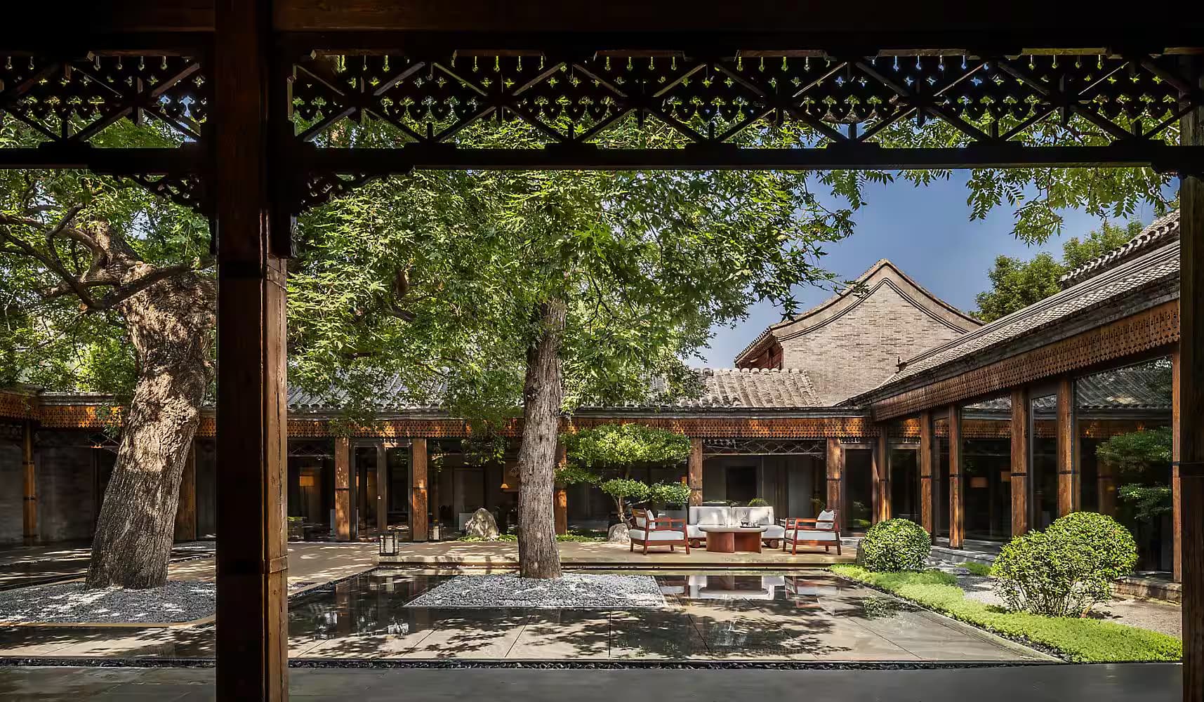 Traditional courtyard architecture and luxury rooms at Mandarin Oriental Qianmen Beijing.