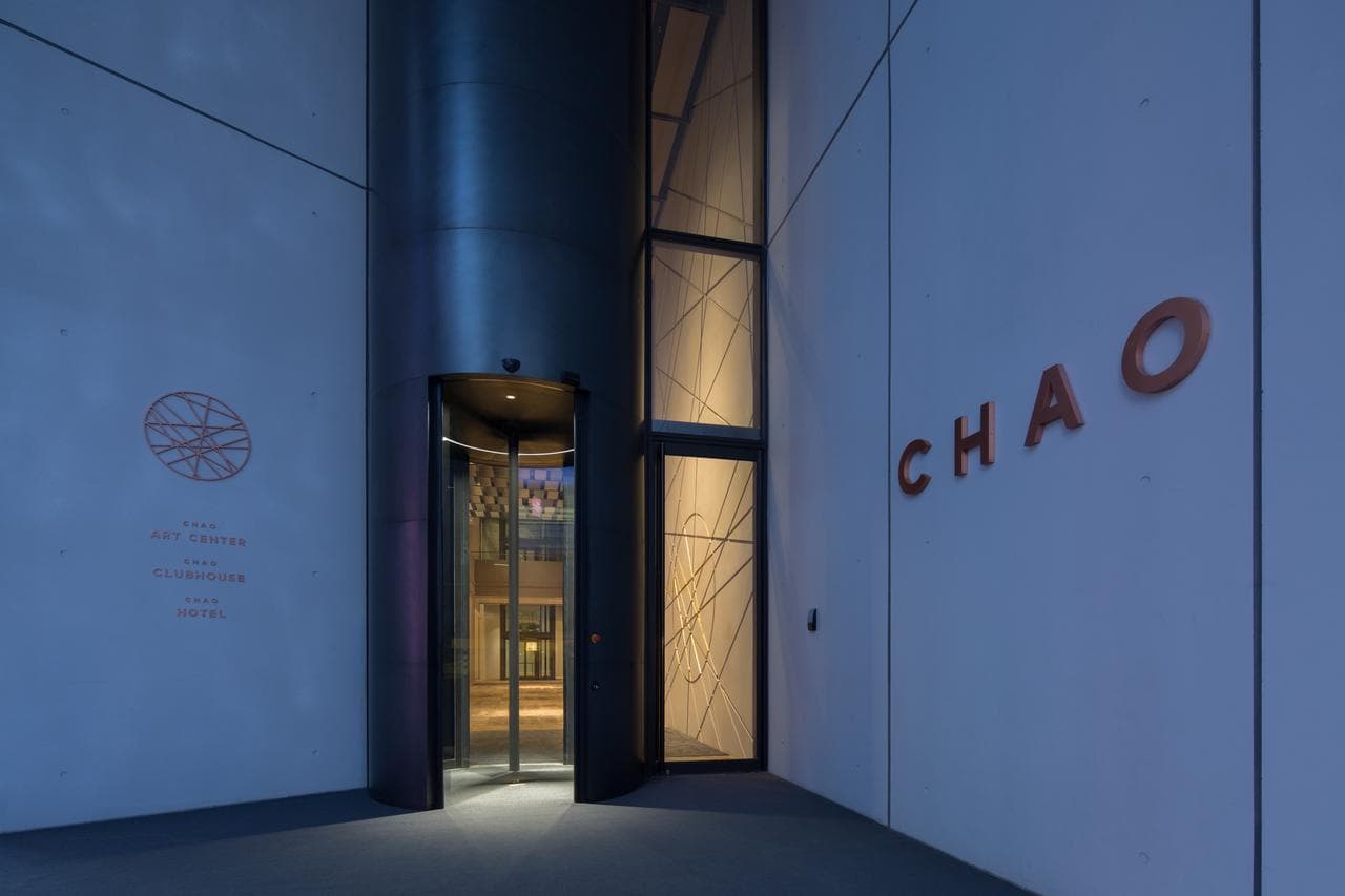 Modern exterior and stylish guest room at Chao Sanlitun Beijing near airport access and central Beijing nightlife