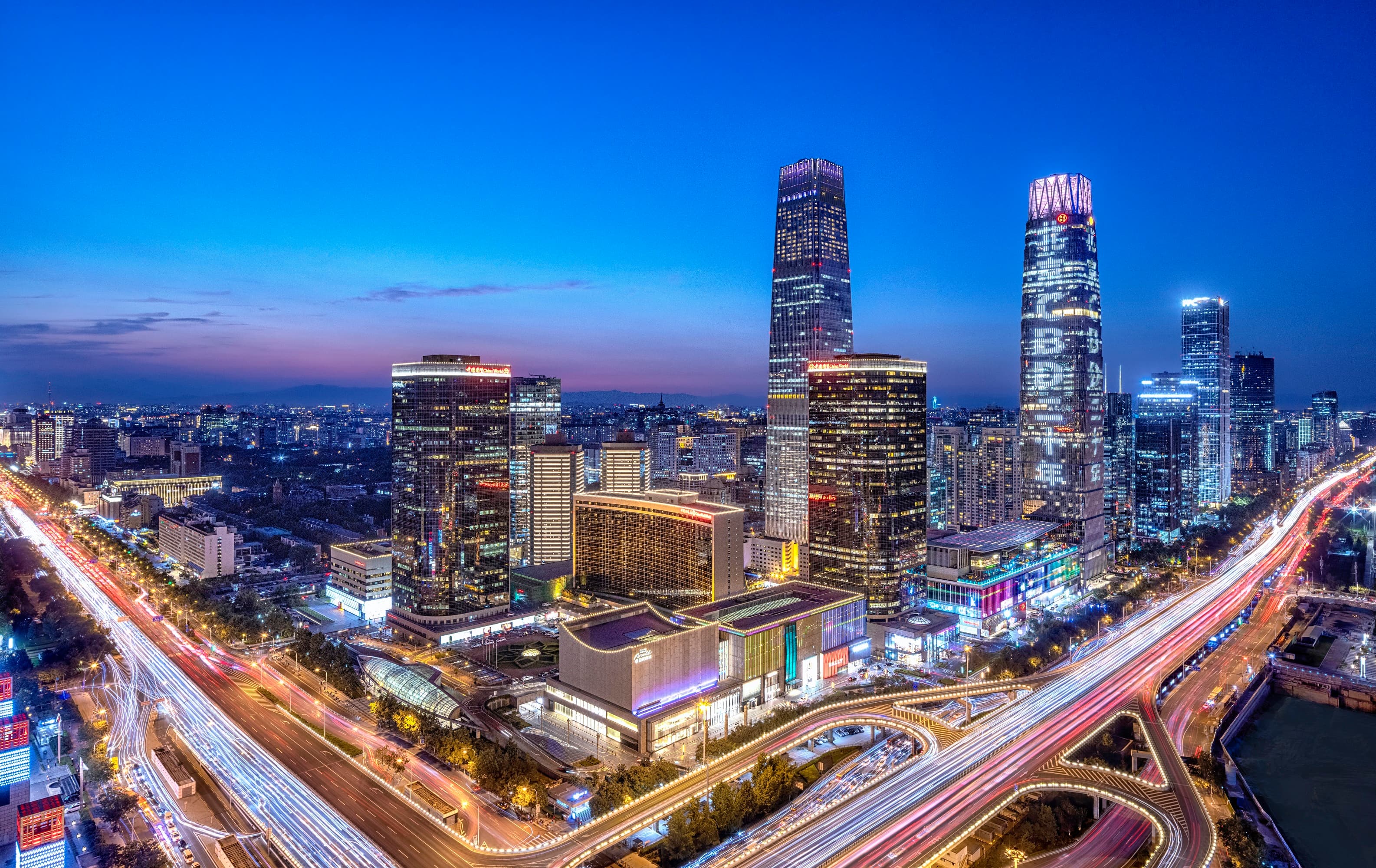 Luxurious Summit Wing Shangri La room in Beijing featuring panoramic city views.