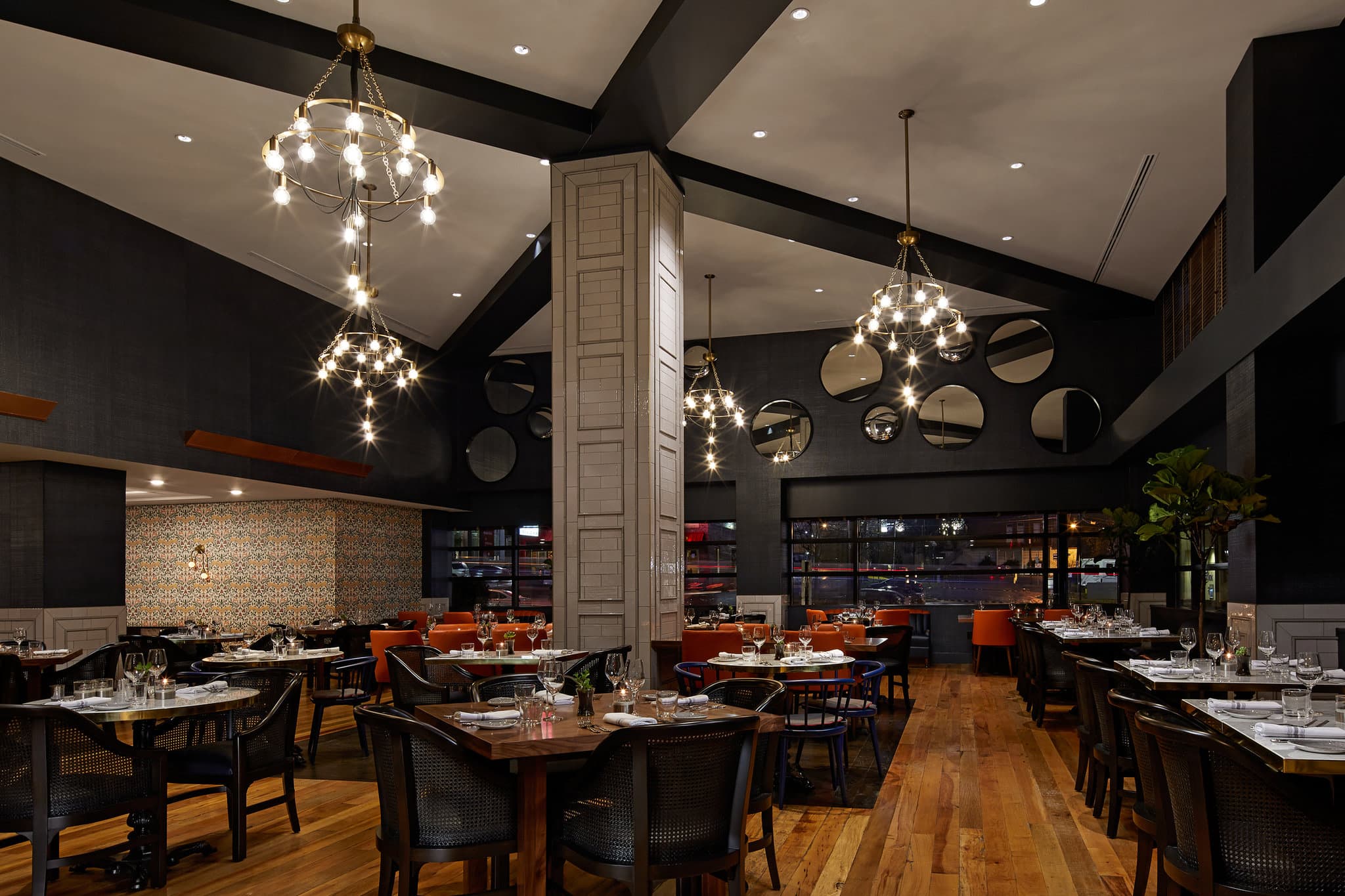 View of the Analog music venue at Hutton Hotel showing the mezzanine balcony, velvet seating, and intimate stage lighting.