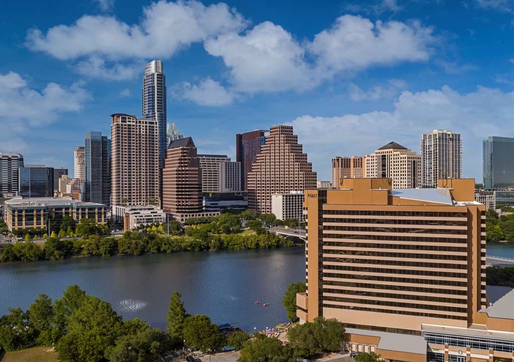 View from Hyatt Regency Austin balcony overlooking Lady Bird Lake and the Congress Avenue Bridge at dusk.