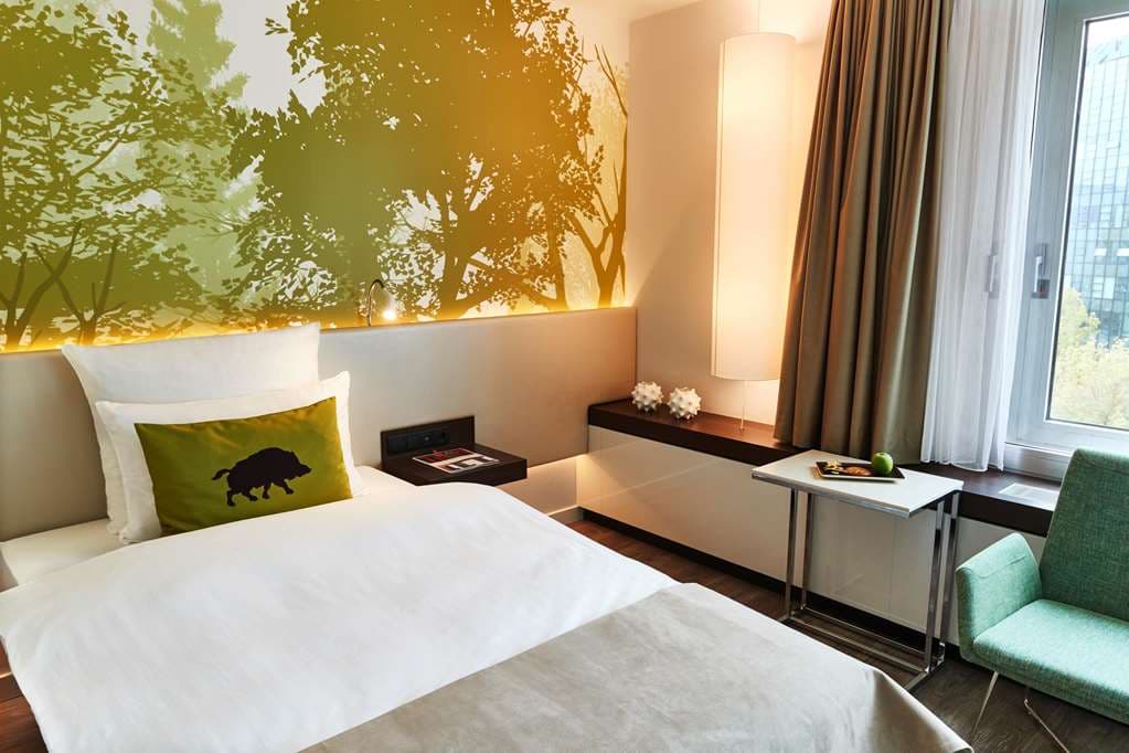 Steigenberger Airport Hotel Frankfurt 9th-floor indoor pool with panoramic windows overlooking the airport tarmac.