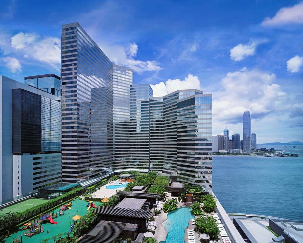 View from a Grand Hyatt Hong Kong guest room featuring the expansive Victoria Harbour skyline and the Convention Centre roof.