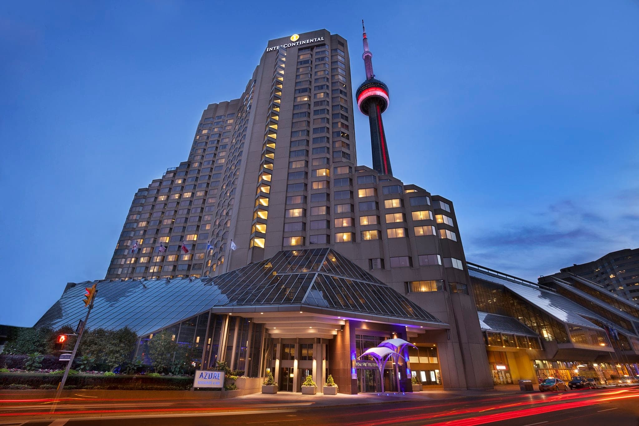 Azure Restaurant glass canopy ceiling illuminated at night with the CN Tower visible above.