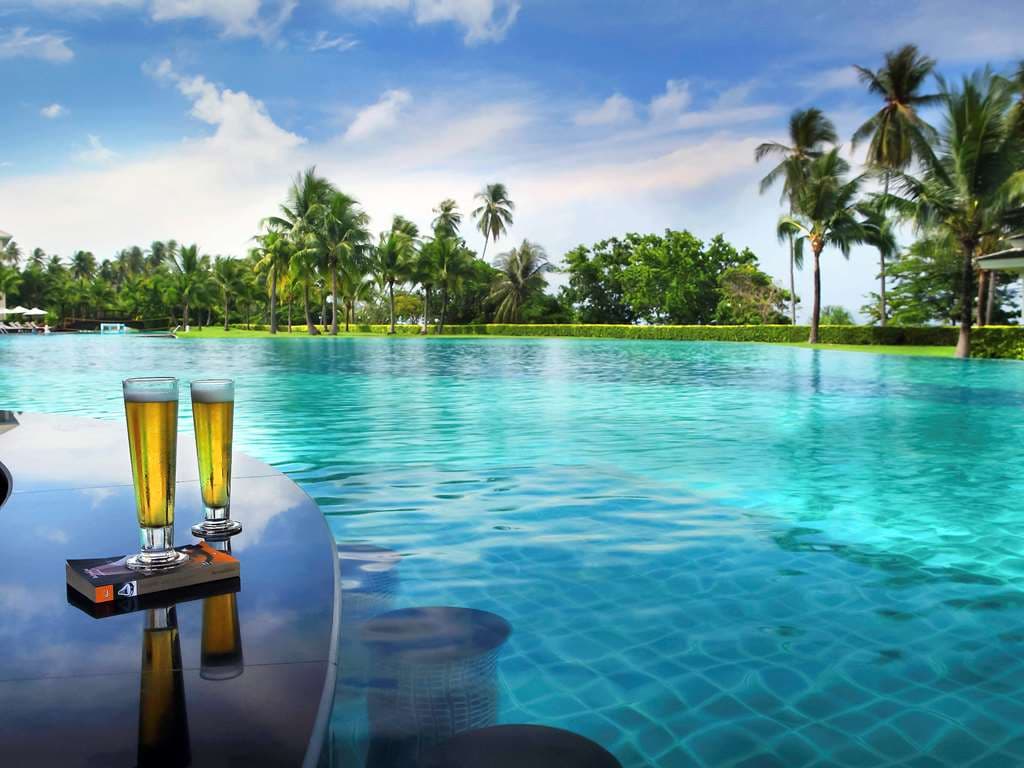 Aerial view of the massive 7,000 sqm lagoon pool at Sofitel Krabi winding through tropical gardens.