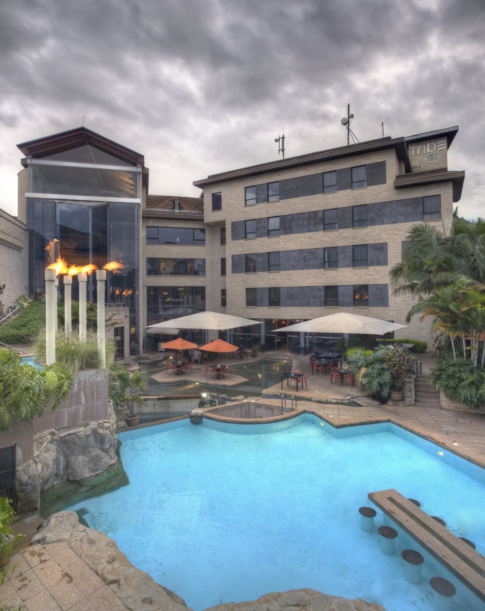 Tribe Hotel Nairobi heated pool with vertical garden and stone walls