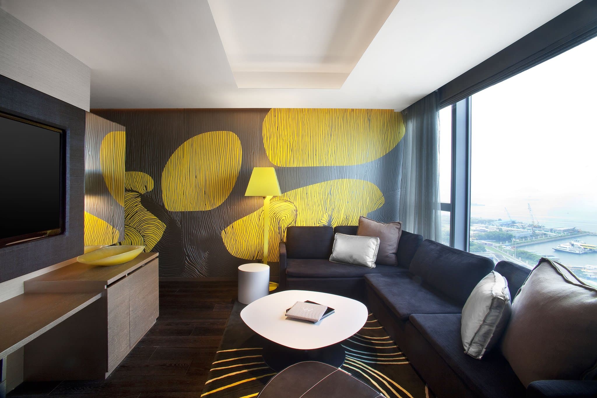 The 76th-floor WET Deck outdoor pool at W Hong Kong featuring a mosaic wall and skyline views.