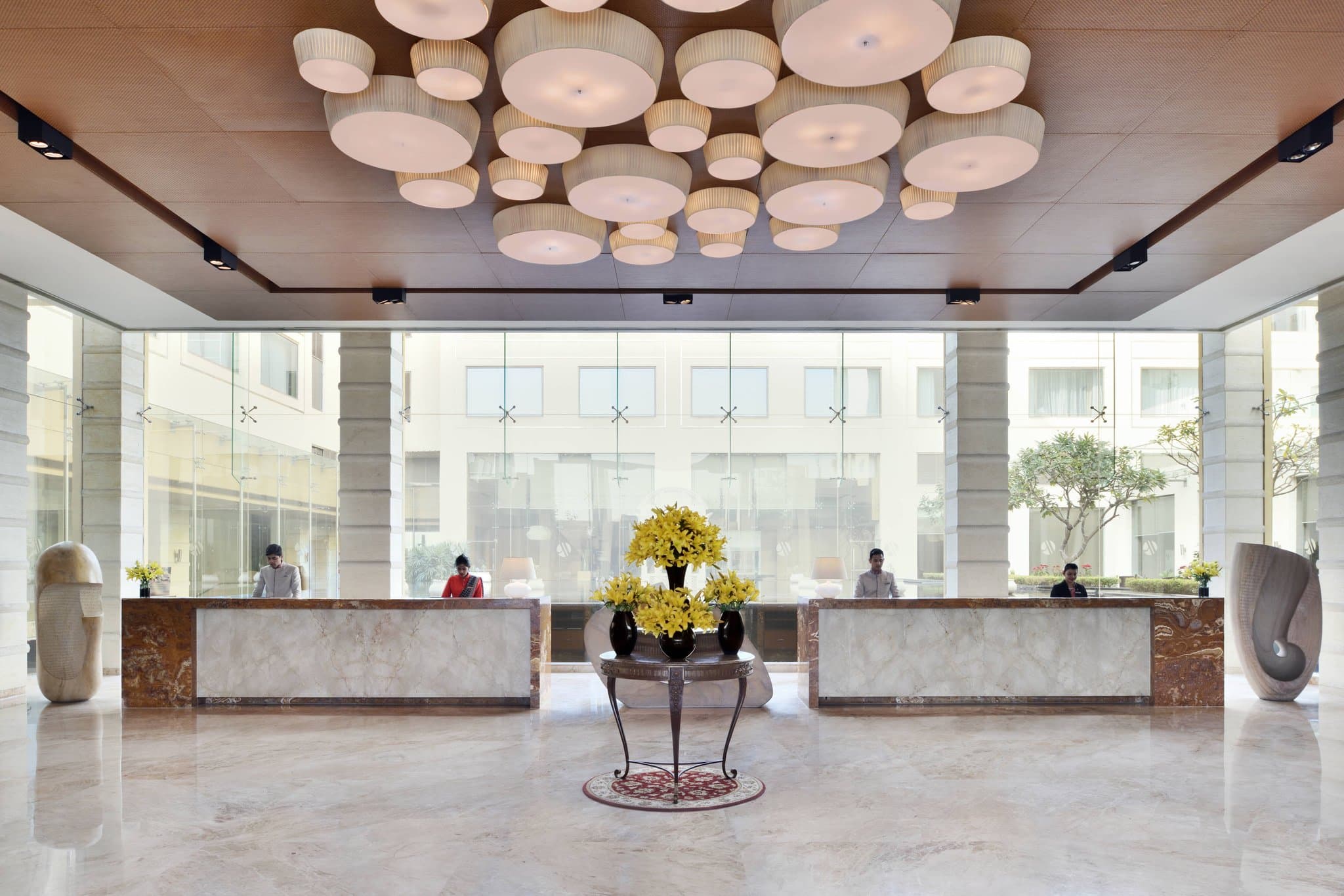 Lounge 18 rooftop bar at Jaipur Marriott during golden hour with city skyline views.