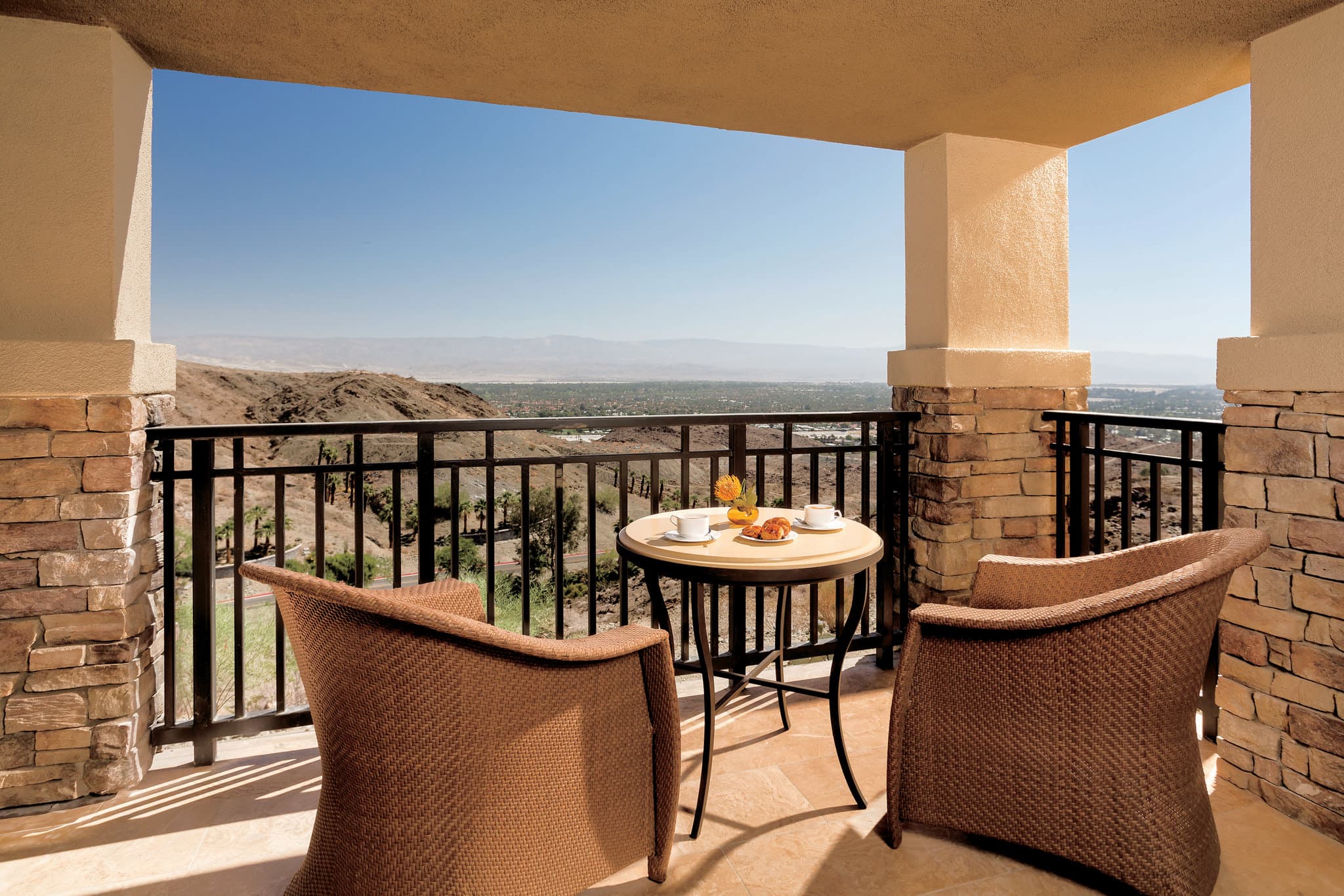 Infinity edge Vista Pool at The Ritz-Carlton Rancho Mirage overlooking the Coachella Valley at sunset.