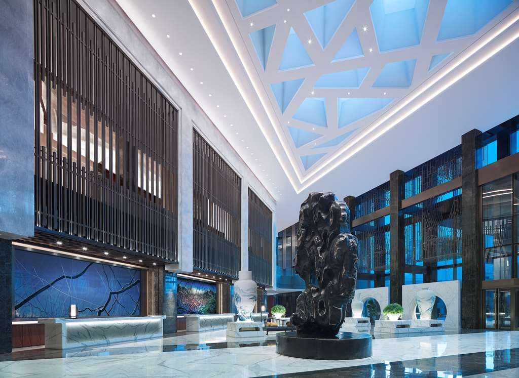 Grand lobby of the 5-star Nuo Hotel Beijing with Ming Dynasty luxury decor.