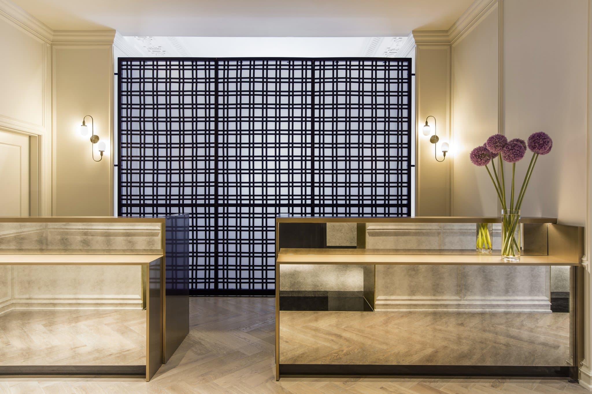 The moody, library-style bar at Vol. 39 in the Kimpton Gray Hotel, featuring leather seating and walls lined with vintage books.