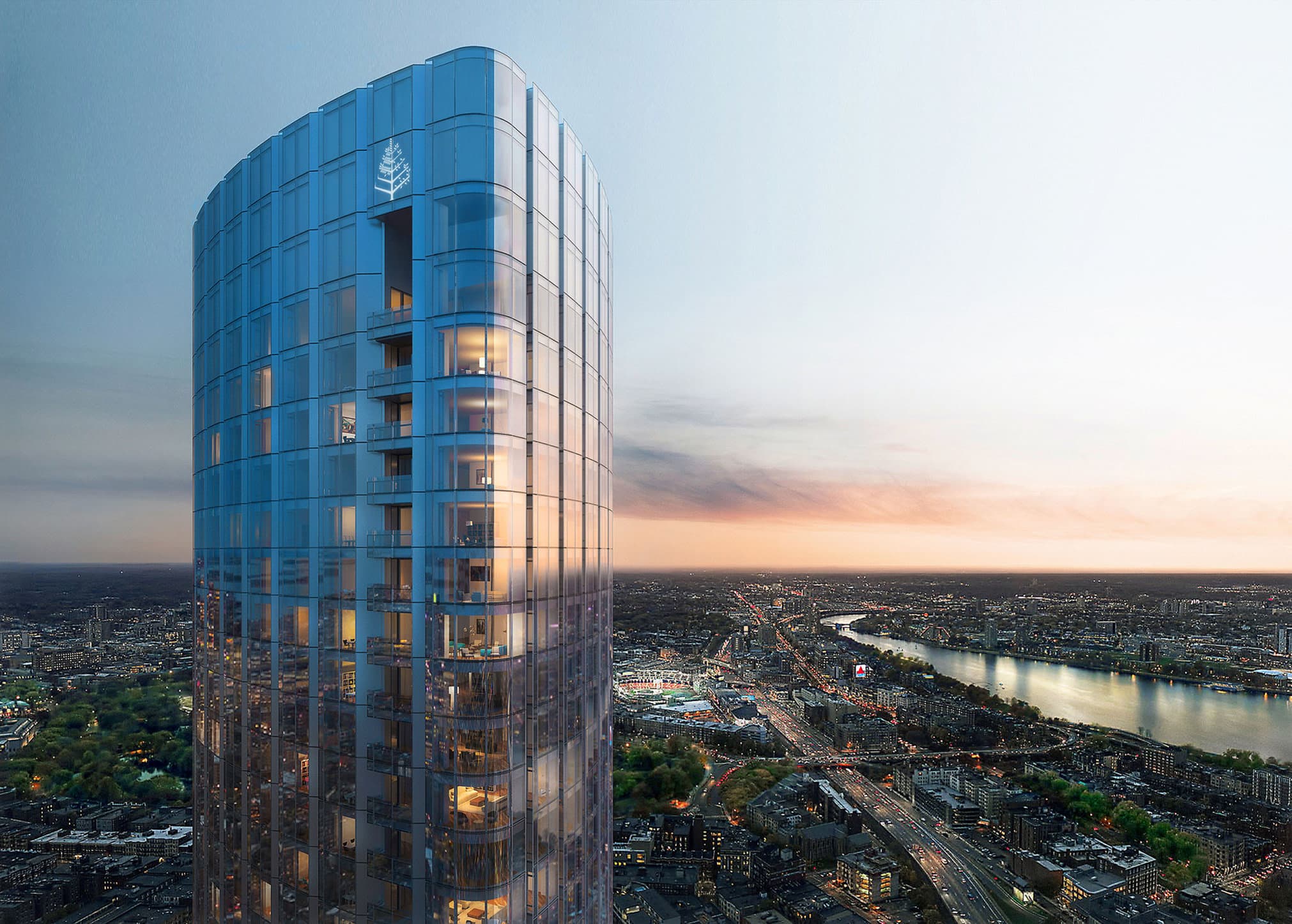 A low-angle shot of the gleaming 61-story glass tower of Four Seasons One Dalton piercing the blue Boston sky.