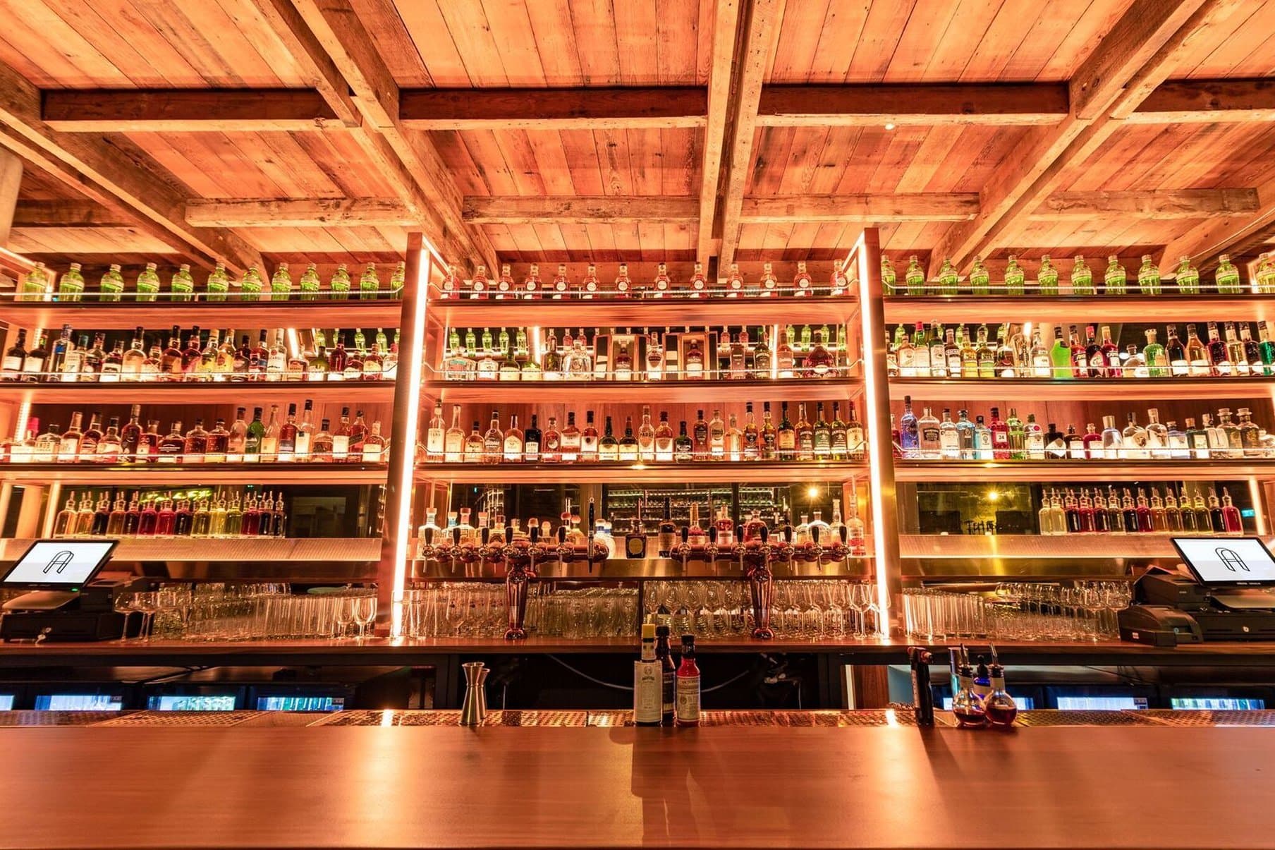 Layla's Rooftop Restaurant at The Devlin Dublin featuring a glass-walled terrace with panoramic views of the Dublin Mountains and retro-chic dining furniture.