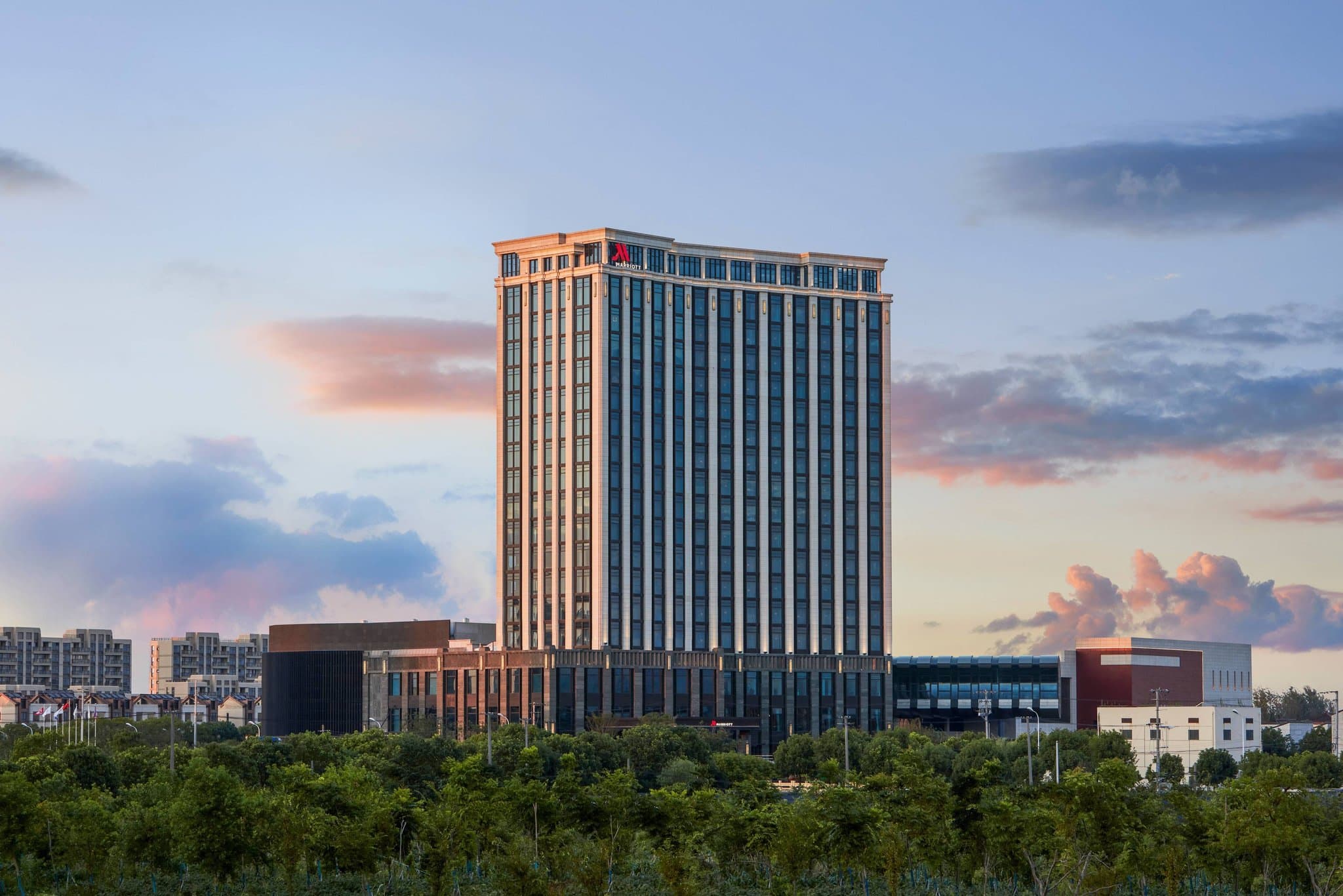 Modern exterior and luxurious lobby of the Shanghai Marriott Hotel Pudong South.