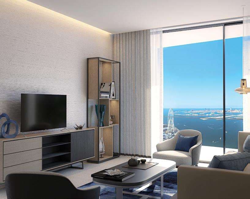 Address Beach Resort의 세계에서 가장 높은 인피니티 풀 가장자리에서 아인 두바이 대관람차를 배경으로 서 있는 여성.