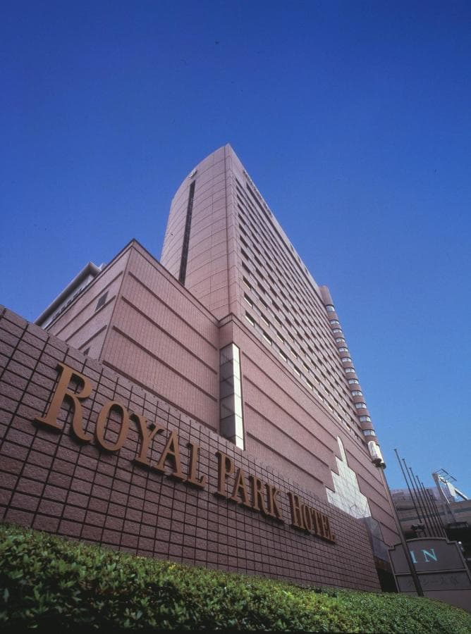 The grand lobby of Royal Park Hotel Tokyo featuring the iconic 'Milky Way' chandelier and double staircase.