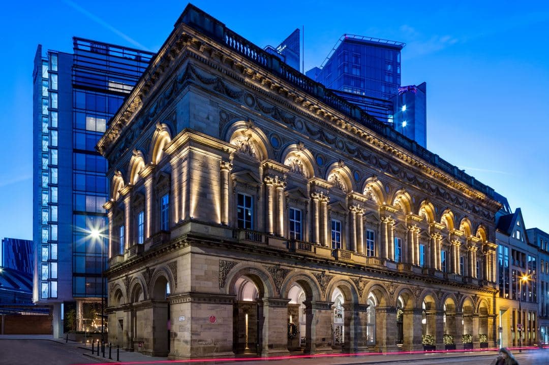The Edwardian Manchester's subterranean swimming pool with aquamarine water and stone arches.