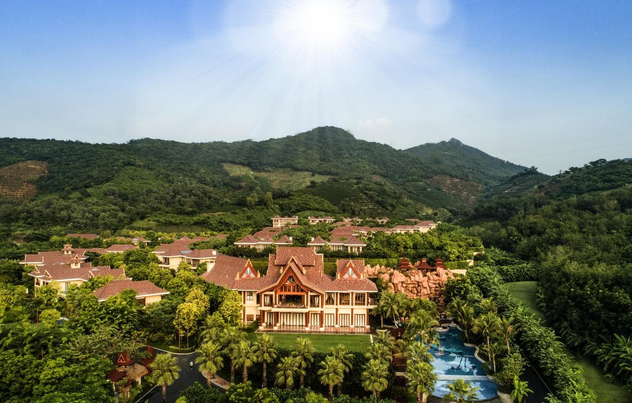 A private infinity pool at Sanya Ocean Sonic Banling villa overlooking the rainforest valley at dusk.
