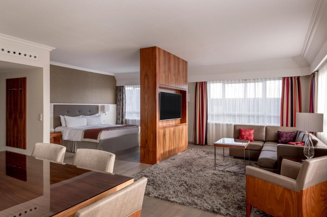 The newly renovated Greatroom lobby at Munich Marriott Hotel featuring modern brass accents and social seating areas.