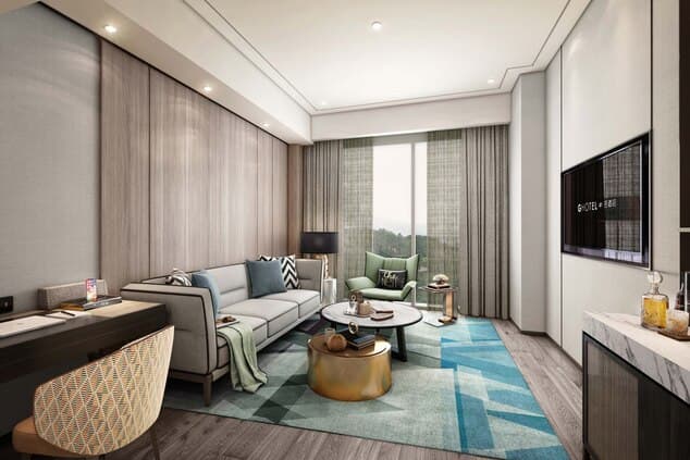 Spacious modern suite at The G Shenzhen A Tribute Portfolio Hotel with a balcony.