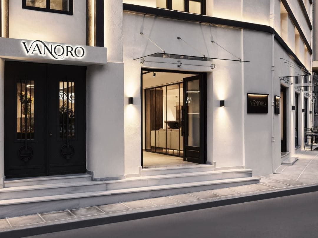 Vanoro Hotel Thessaloniki exterior featuring 1937 industrial architecture with Art Deco lighting and Anza Kitchen interior.