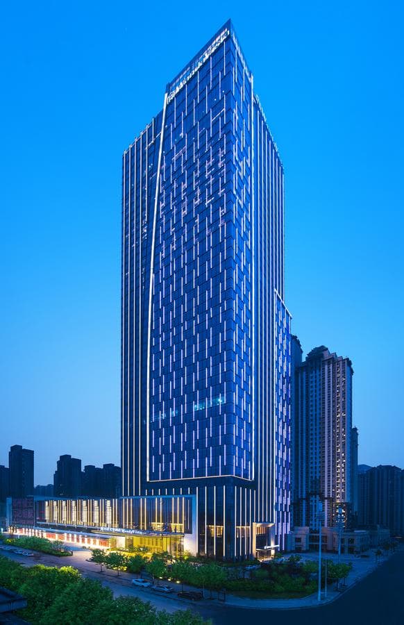 Wanda Vista Zhengzhou 48th floor Sky Lobby featuring a massive crystal chandelier inspired by the Yellow River.