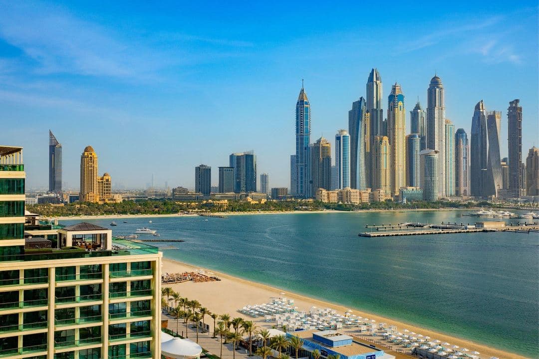 Marriott Resort Palm Jumeirah outdoor pool with swim-up bar and Dubai Marina skyline in background