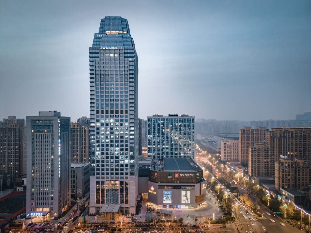 Luxurious guest room at JW Marriott Hotel Xi'an featuring modern decor and city views.