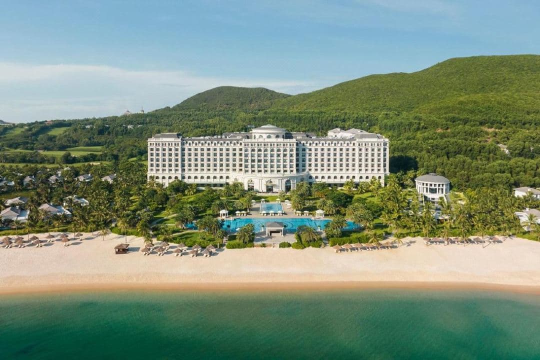 Private villa infinity pool at Nha Trang Marriott Resort & Spa overlooking the East Sea at dusk.