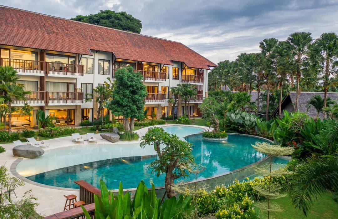 A serene private villa pool at Sanctoo Suites overlooking the lush Ubud jungle, contrasting with the African Savannah-themed lagoon pool.