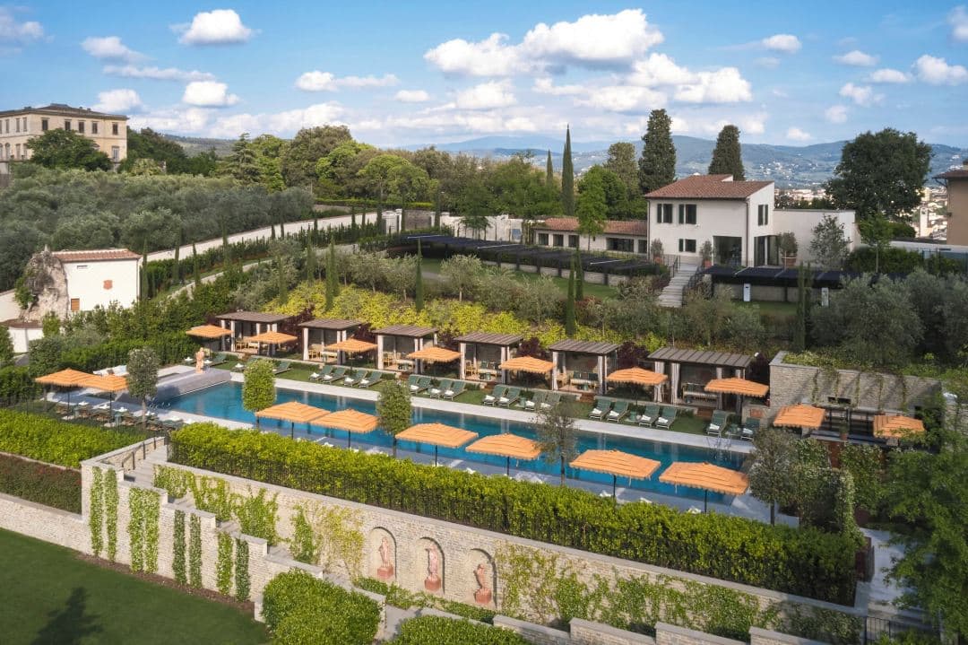 The expansive 35m outdoor pool at Collegio alla Querce set within terraced Baroque gardens overlooking Florence.