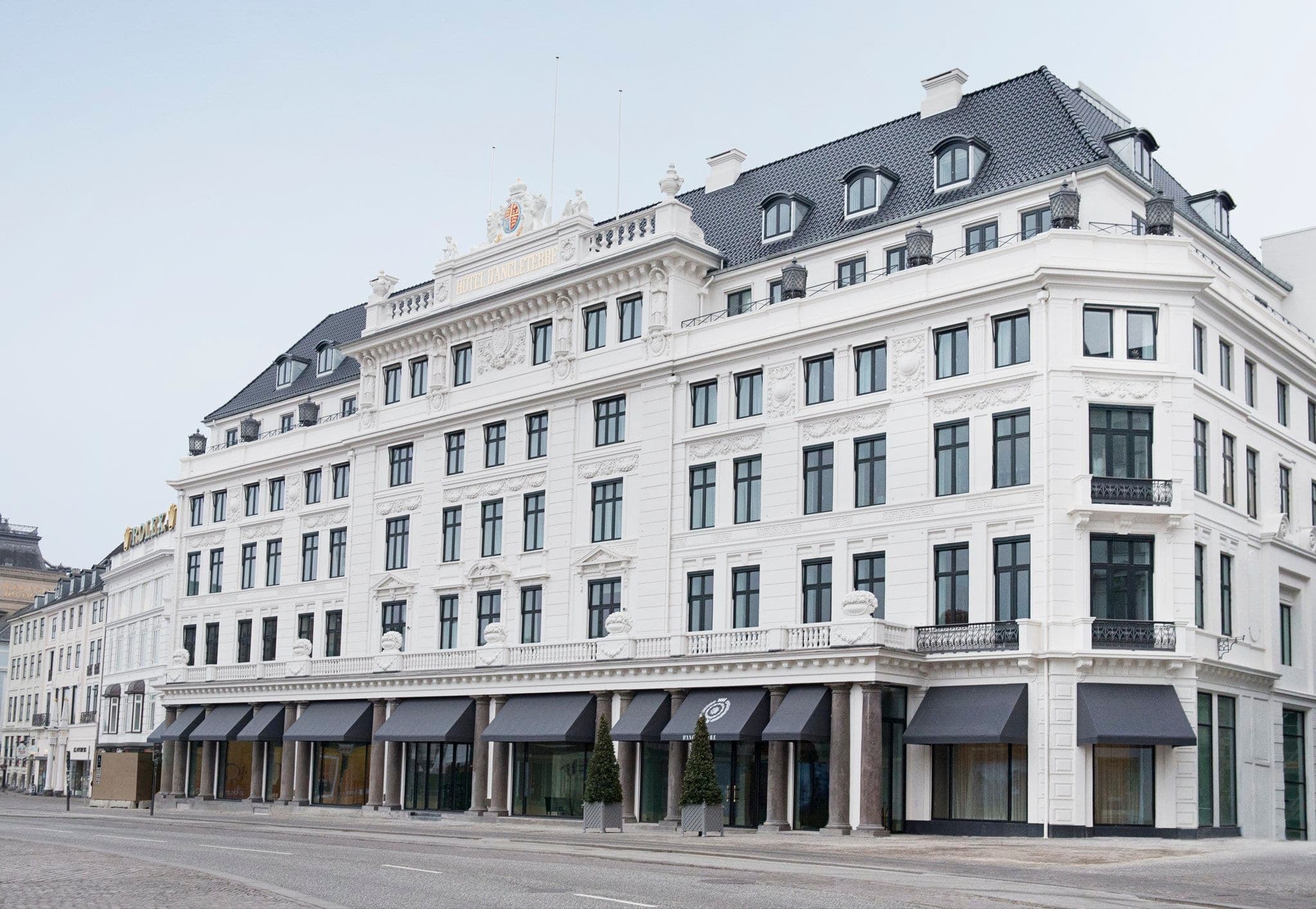 The iconic white facade of Hotel d'Angleterre lit up at night on King's New Square.