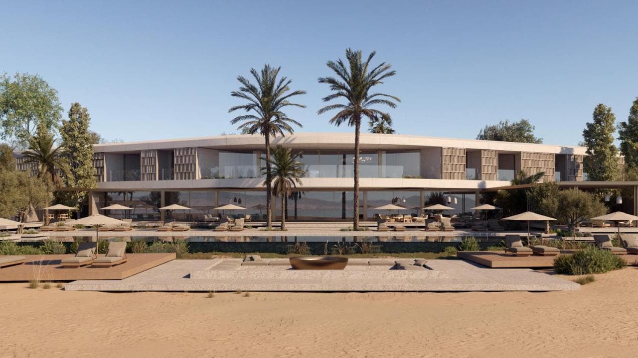 One&Only Aesthesis main pool framed by ancient olive trees and mid-century bungalows at sunset