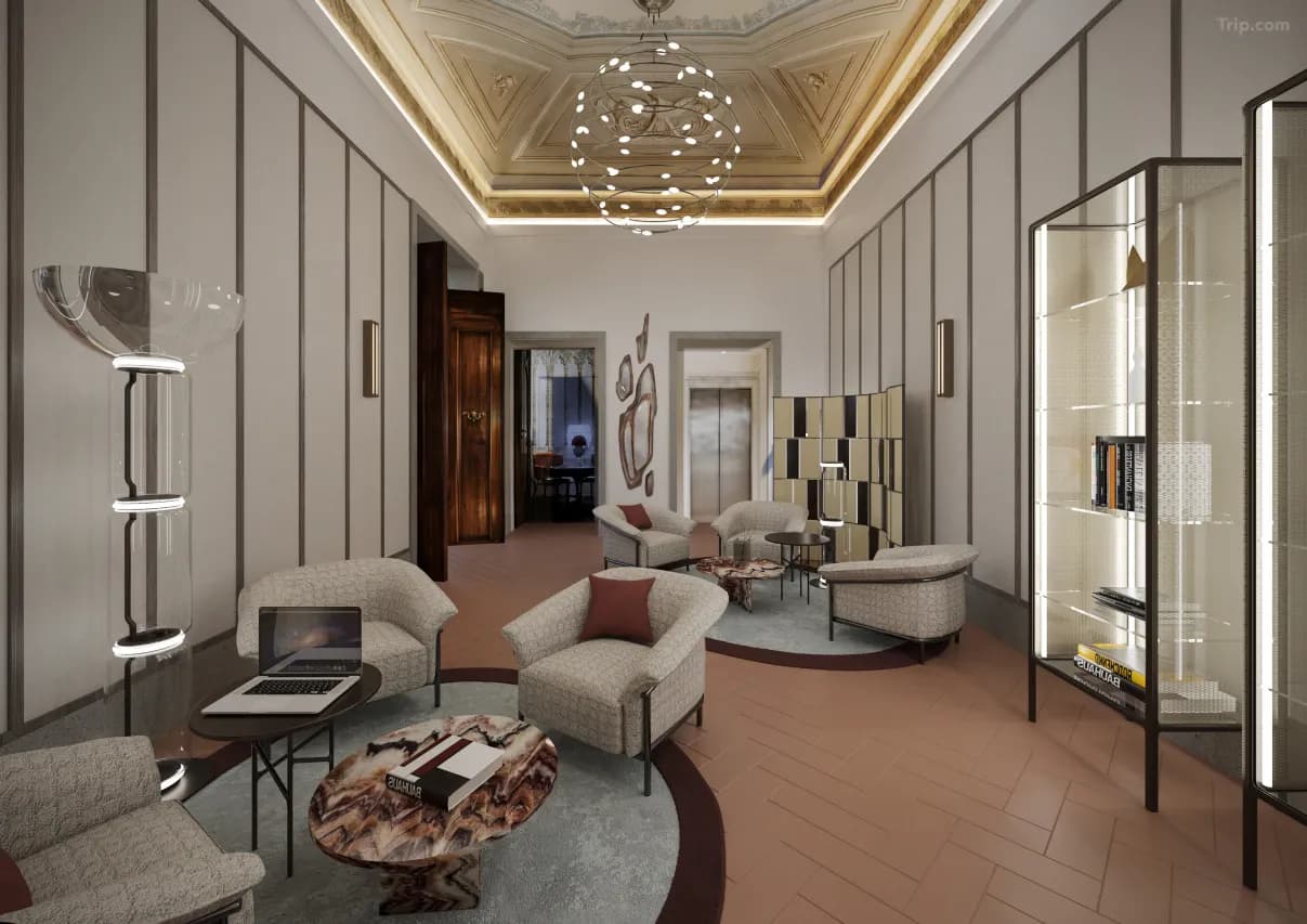 The opulent Music Room at Palazzo Firenze featuring a massive crystal chandelier and 18th-century frescoes.