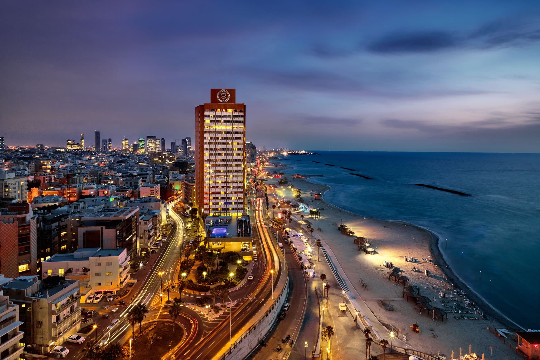 View from Sheraton Grand Tel Aviv balcony overlooking Gordon Beach and the Mediterranean Sea.
