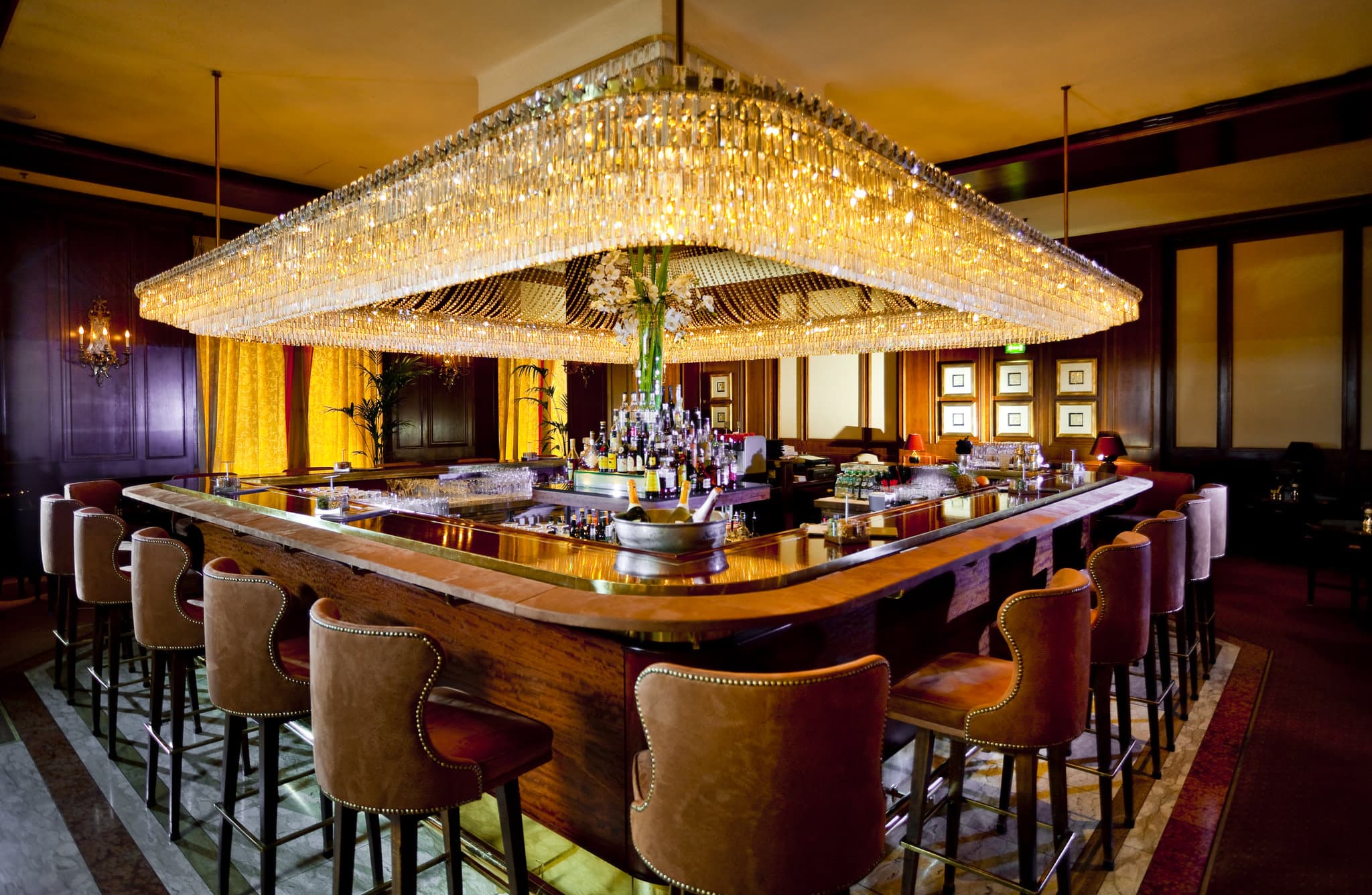 The retro-glamorous Intermezzo Bar at InterContinental Vienna featuring a 1960s coffered ceiling and low velvet seating.