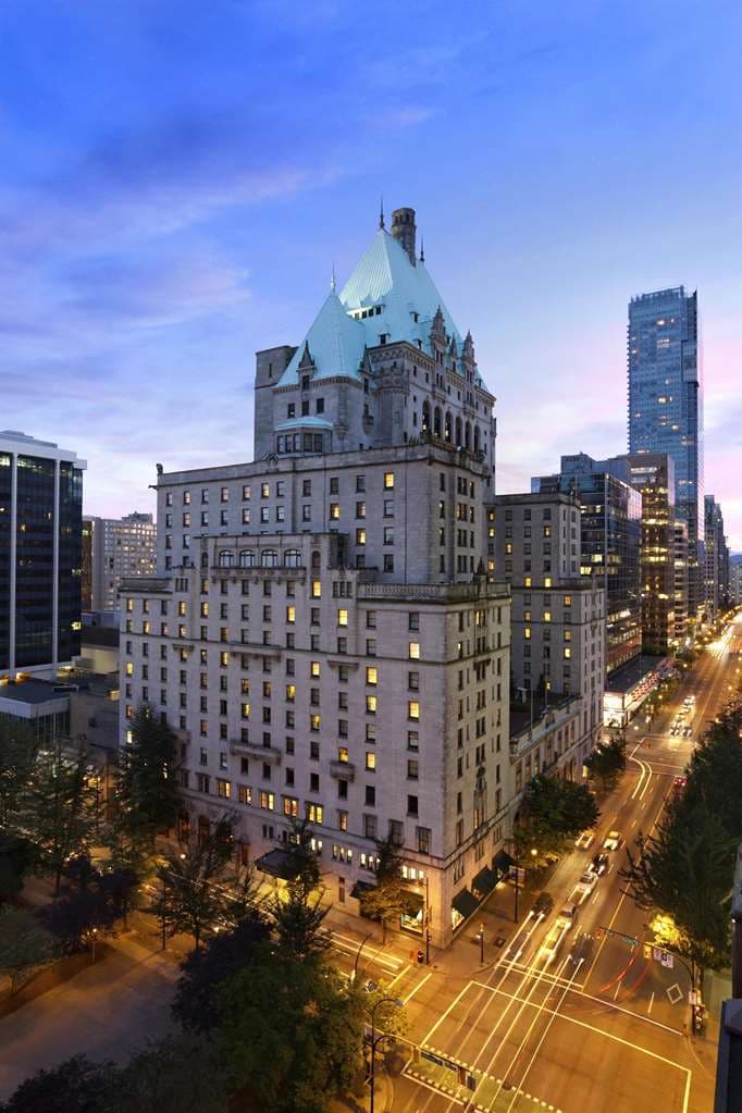 The Fairmont Hotel Vancouver's iconic copper roof and gargoyles towering over downtown Vancouver's luxury retail district.