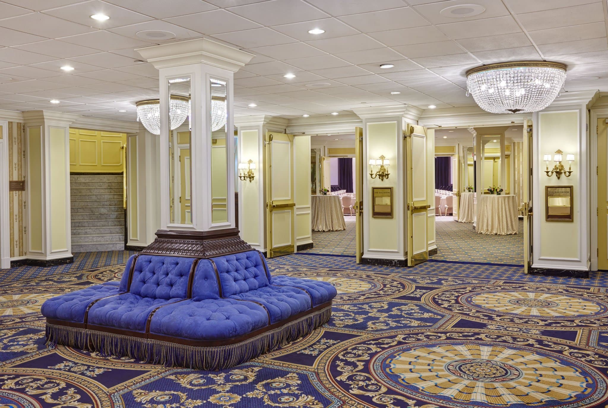 The ornate Beaux-Arts lobby of the Willard InterContinental with its famous seal-adorned ceiling and chandeliers.
