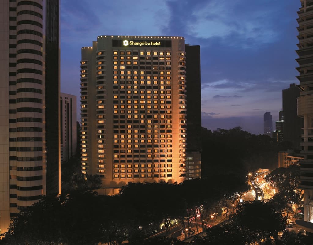 Aerial view of Shangri-La Kuala Lumpur's maze garden and pool with KL Tower in the background.