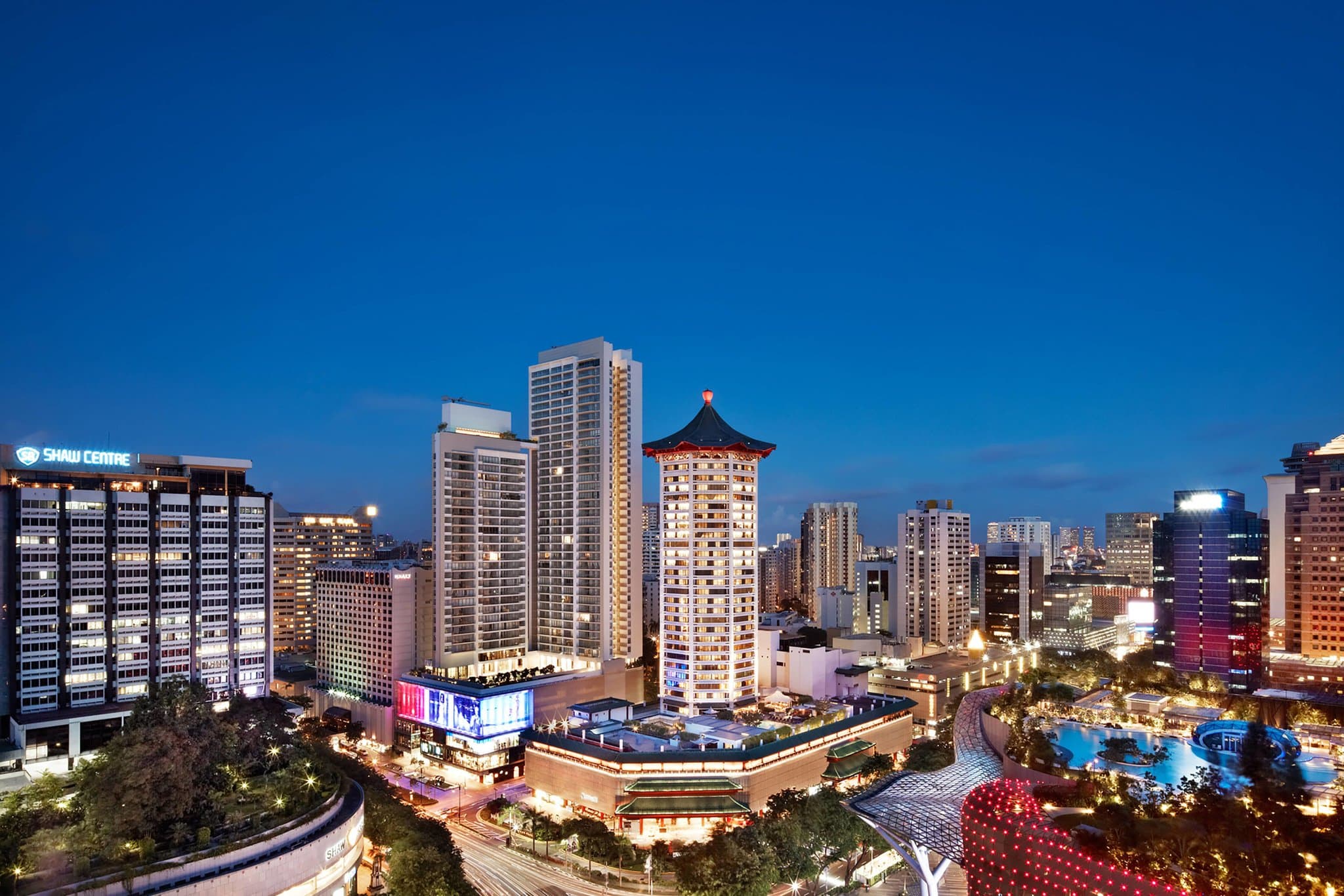 The iconic octagonal green pagoda tower of Singapore Marriott Tang Plaza Hotel rising above Orchard Road.