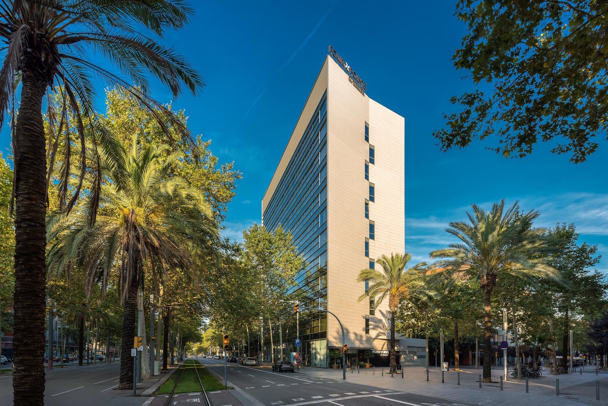 View from a corner room at Four Points Barcelona Diagonal featuring the Sagrada Família skyline.