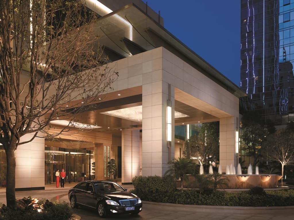 Exterior of Futian Shangri-La hotel in Shenzhen featuring luxury rooms and modern architecture.