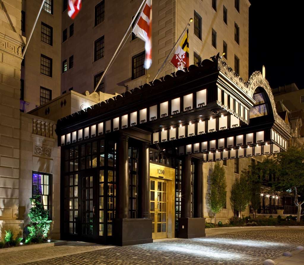 The Jefferson DC's Greenhouse restaurant featuring a checkered marble floor and a historic 1923 stained-glass skylight.