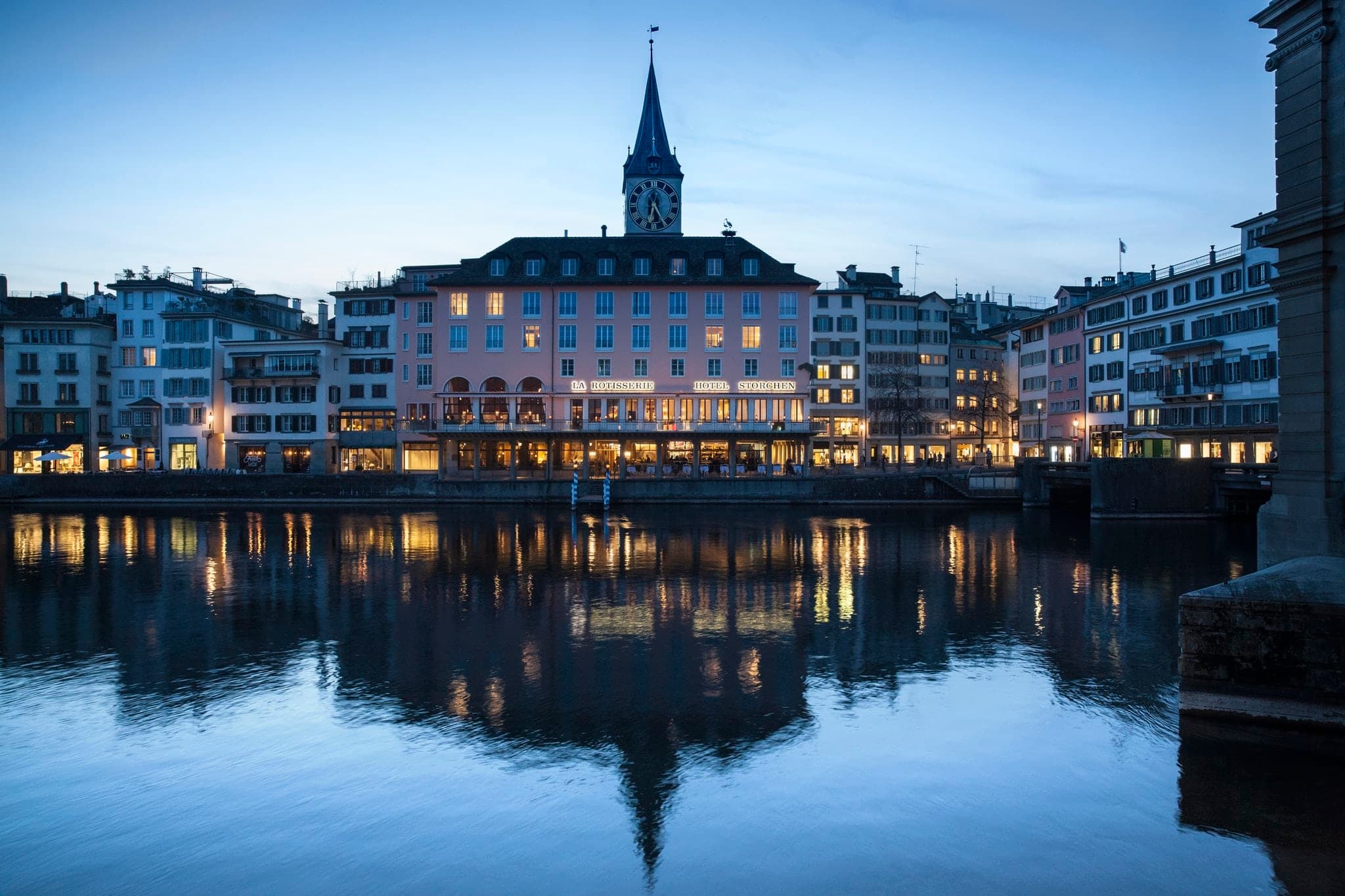 Storchen Zurich terrace dining on the River Limmat with view of Grossmünster cathedral